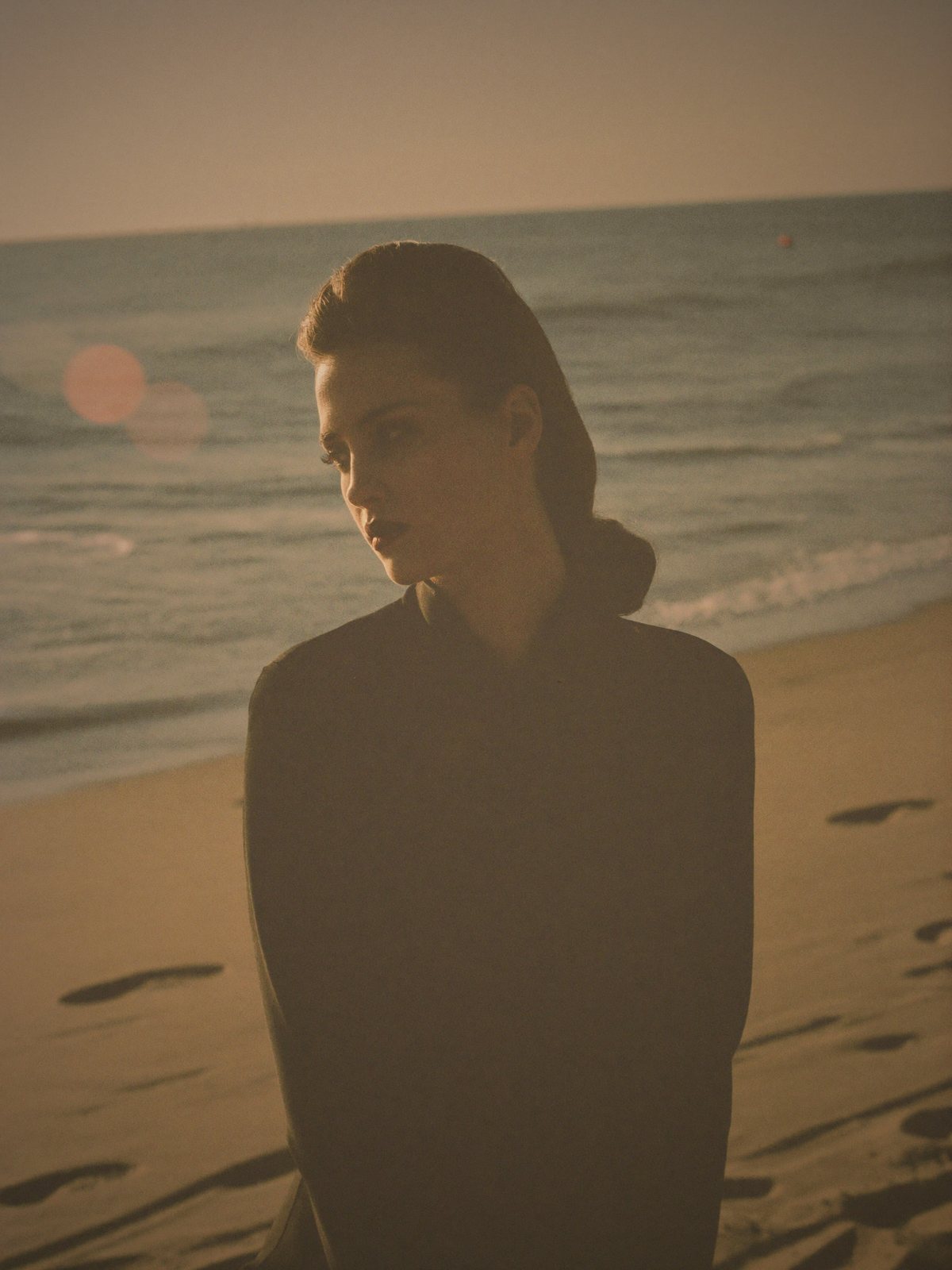 Cora Del Mar on the beach at golden hour
